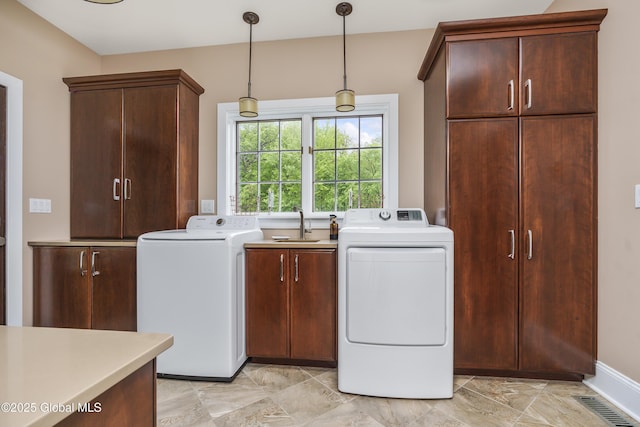 17 Brendan Ln, Niskayuna, NY 12309 - laundry room with cabinet space, washing machine and dryer, and baseboards