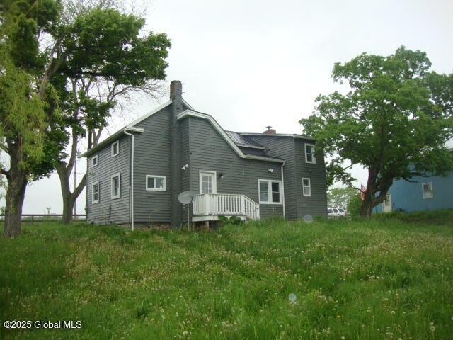422 W Ames Rd, Canajoharie, NY 13317 - back of house with a chimney