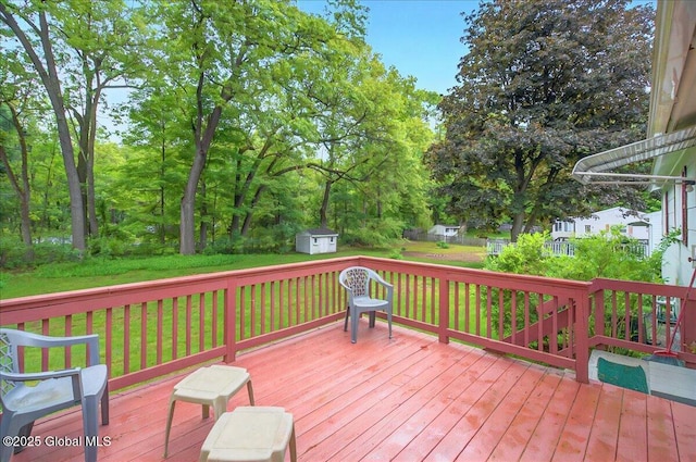 3 N Jordan Dr, Saratoga Springs, NY 12866 - wooden terrace featuring a shed and a lawn
