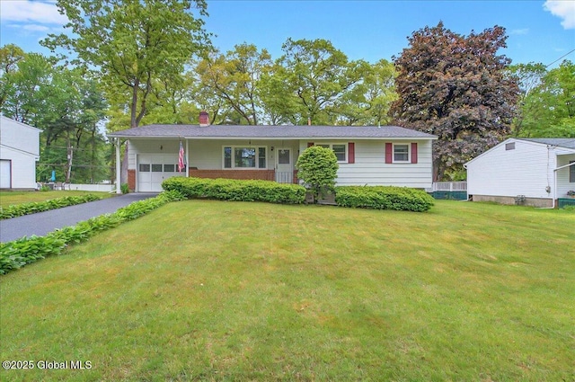 3 N Jordan Dr, Saratoga Springs, NY 12866 - ranch-style home featuring an attached garage, a front yard, asphalt driveway, and a chimney
