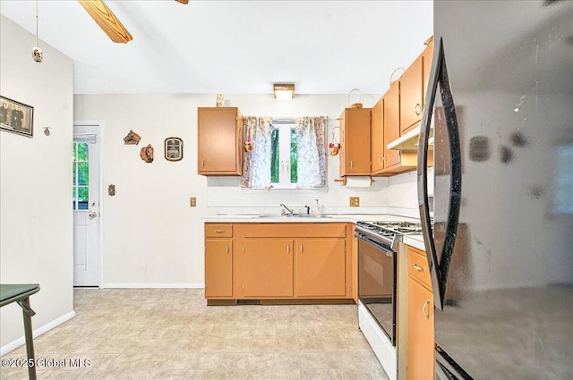 3 N Jordan Dr, Saratoga Springs, NY 12866 - kitchen featuring refrigerator, gas stove, plenty of natural light, and light countertops