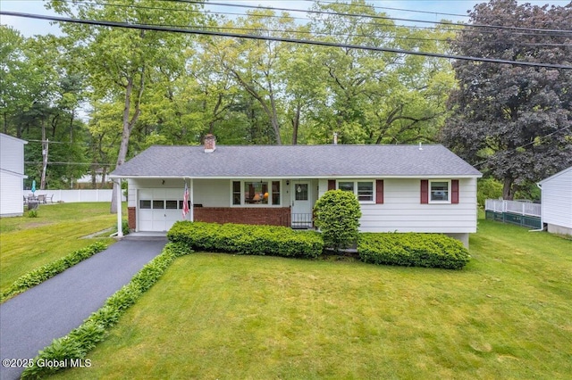 3 N Jordan Dr, Saratoga Springs, NY 12866 - ranch-style house with an attached garage, driveway, a chimney, a shingled roof, and view of scattered trees