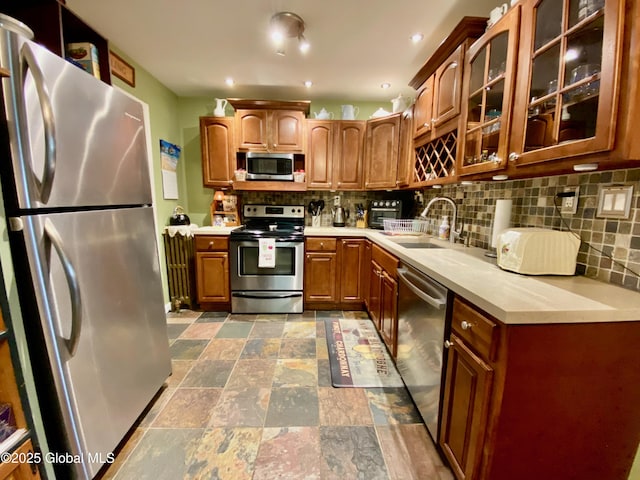 1926 Golf Ave, Schenectady, NY 12308 - kitchen featuring stainless steel appliances, a sink, stone finish flooring, light countertops, and recessed lighting