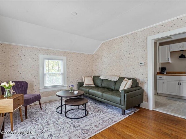 2 Van Rensselear St, Saratoga Springs, Inside, NY 12866 - living area featuring crown molding, wallpapered walls, light wood finished floors, vaulted ceiling, and baseboards