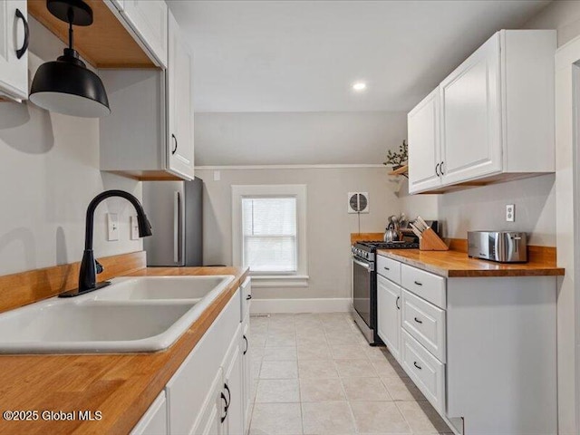 2 Van Rensselear St, Saratoga Springs, Inside, NY 12866 - kitchen with stainless steel gas range, a sink, butcher block counters, baseboards, and light tile patterned flooring