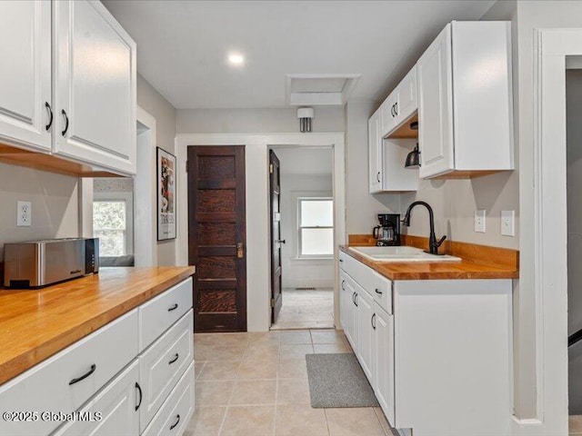 2 Van Rensselear St, Saratoga Springs, Inside, NY 12866 - kitchen featuring a sink, wooden counters, white cabinets, and light tile patterned flooring