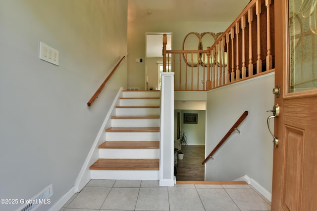 23 Bayberry Dr, Halfmoon, NY 12065 - stairway featuring tile patterned floors and baseboards