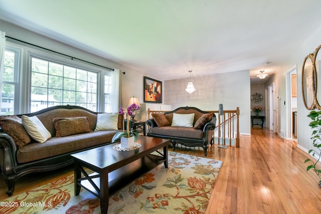 23 Bayberry Dr, Halfmoon, NY 12065 - living room with light wood-style floors and baseboards