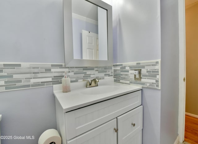 23 Bayberry Dr, Halfmoon, NY 12065 - bathroom with vanity, tasteful backsplash, and ornamental molding