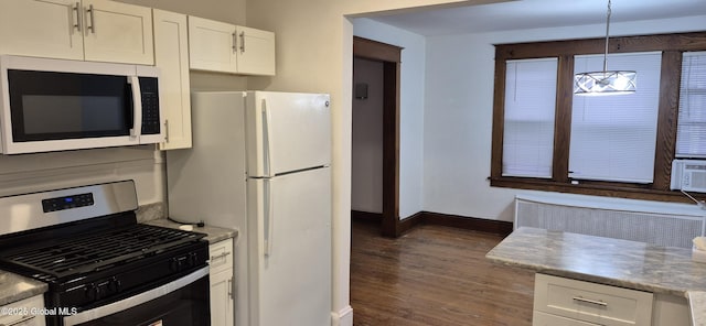 176 Benson St, Albany, NY 12206 - kitchen with white appliances, baseboards, white cabinetry, dark wood-style flooring, and hanging light fixtures