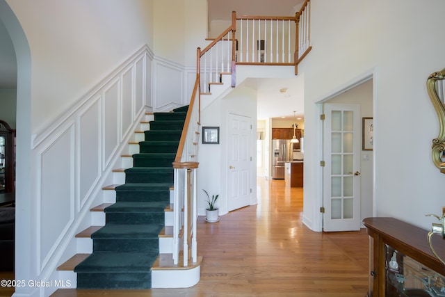 1 Avalon Ct, Colonie, NY 12211 - stairway with arched walkways and wood finished floors