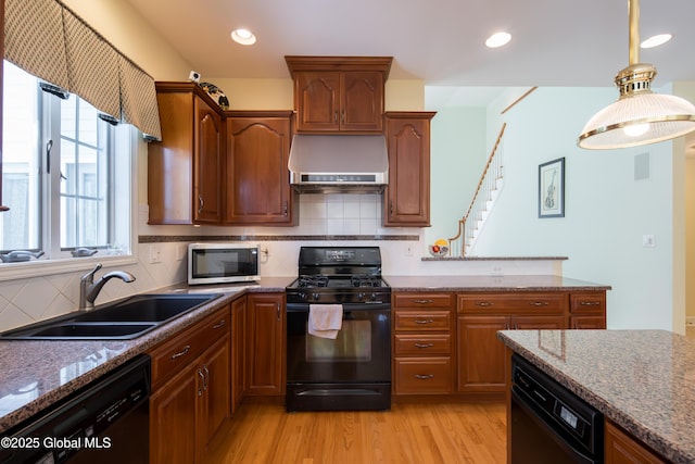 1 Avalon Ct, Colonie, NY 12211 - kitchen featuring black appliances, wall chimney range hood, a sink, light wood-style floors, and stone counters