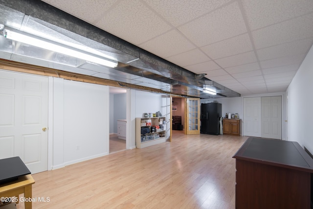 1 Avalon Ct, Colonie, NY 12211 - finished basement with black fridge, wood finished floors, a drop ceiling, and baseboards
