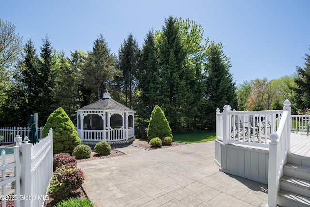 1 Avalon Ct, Colonie, NY 12211 - view of patio featuring a gazebo, view of scattered trees, and a deck