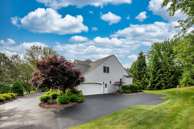 1 Avalon Ct, Colonie, NY 12211 - view of home's exterior with a garage, asphalt driveway, a lawn, and roof with shingles