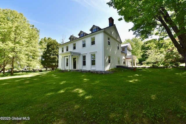 51 Hoffman Rd, Milton, NY 12866 - back of property featuring a chimney and a lawn