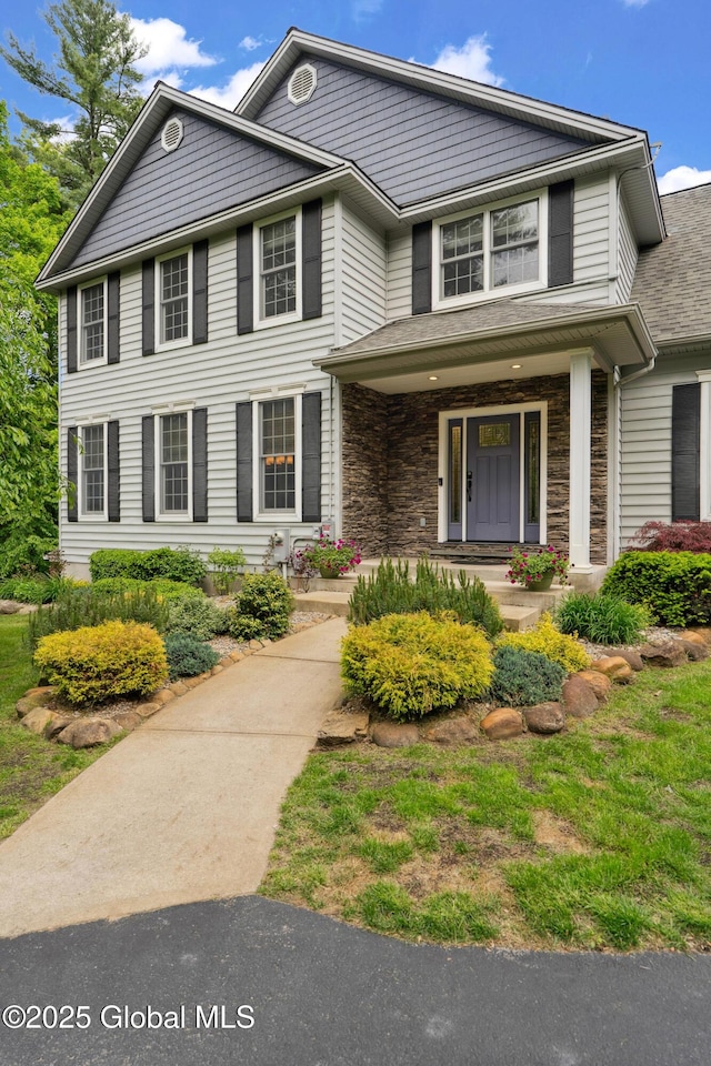 151 Edie Rd, Wilton, NY 12866 - view of front facade featuring covered porch and stone siding
