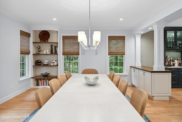 151 Edie Rd, Wilton, NY 12866 - dining area with ornate columns, ornamental molding, healthy amount of natural light, light wood-style floors, and recessed lighting