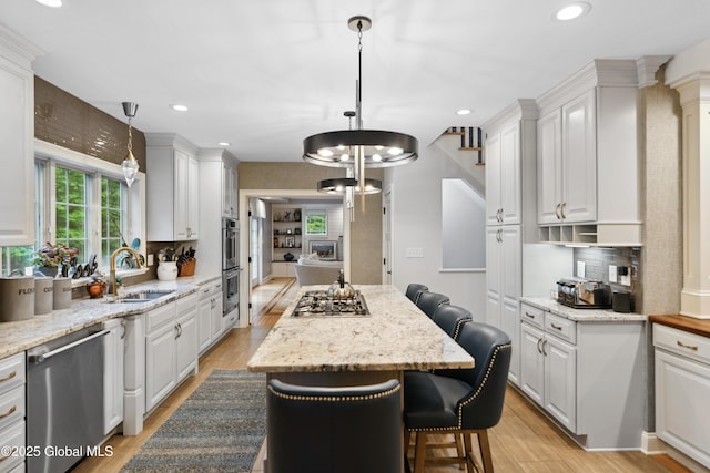 151 Edie Rd, Wilton, NY 12866 - kitchen featuring appliances with stainless steel finishes, a sink, white cabinetry, and recessed lighting