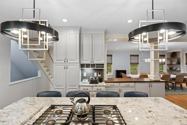 151 Edie Rd, Wilton, NY 12866 - kitchen with a chandelier, recessed lighting, white cabinetry, wood finished floors, and decorative backsplash