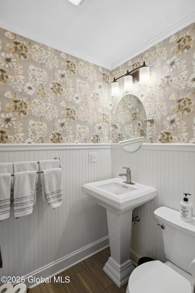 151 Edie Rd, Wilton, NY 12866 - bathroom featuring a wainscoted wall, wood finished floors, toilet, wallpapered walls, and a sink