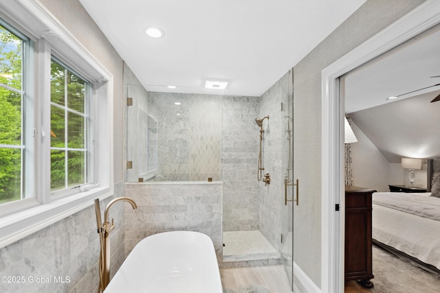 151 Edie Rd, Wilton, NY 12866 - ensuite bathroom featuring a freestanding bath, a shower stall, recessed lighting, tile walls, and ceiling fan