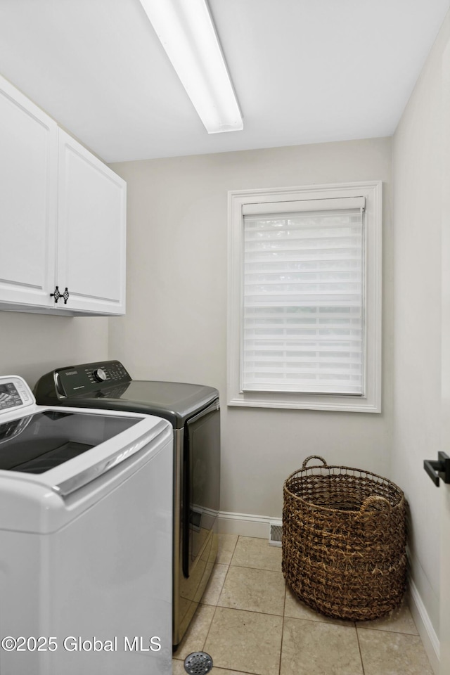 151 Edie Rd, Wilton, NY 12866 - laundry area featuring washing machine and clothes dryer, baseboards, cabinet space, and light tile patterned floors