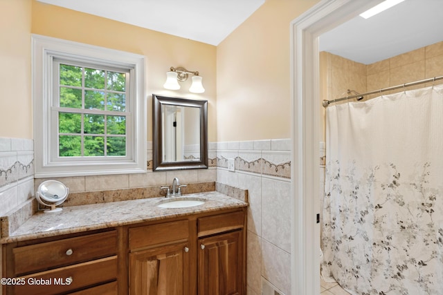 151 Edie Rd, Wilton, NY 12866 - full bath featuring tile walls, vanity, a shower with shower curtain, wainscoting, and tile patterned flooring