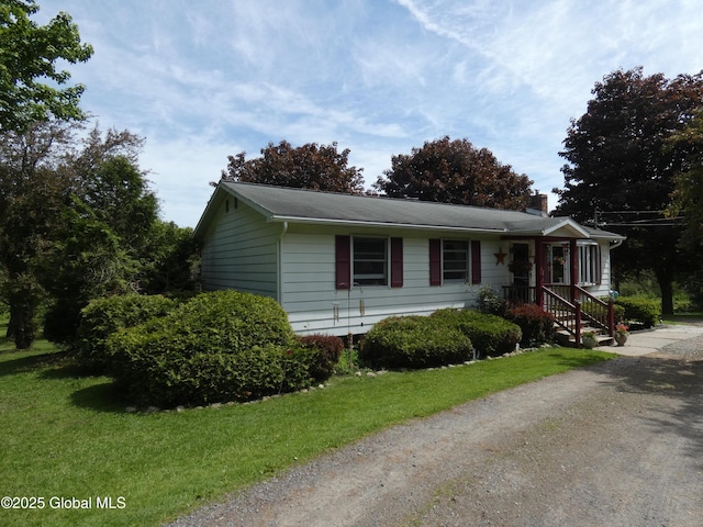 2541 N Line Rd, Galway, NY 12074 - single story home featuring a chimney and a front lawn