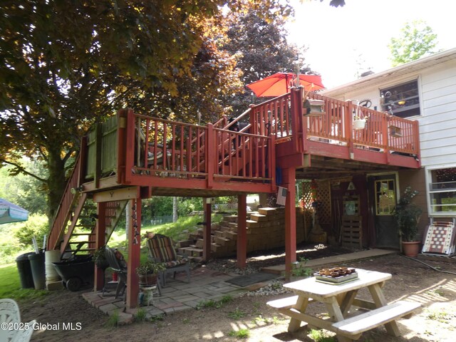 2541 N Line Rd, Galway, NY 12074 - back of property with stairway, a patio, and a wooden deck