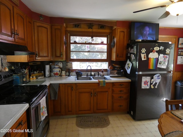 2541 N Line Rd, Galway, NY 12074 - kitchen with electric stove, freestanding refrigerator, under cabinet range hood, a sink, and light countertops