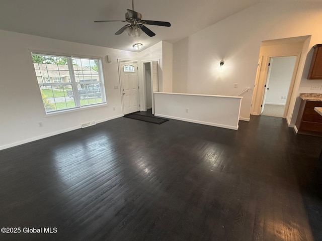 11 E Boylston St, Glens Falls, NY 12801 - unfurnished living room featuring vaulted ceiling, dark wood-style floors, baseboards, and ceiling fan