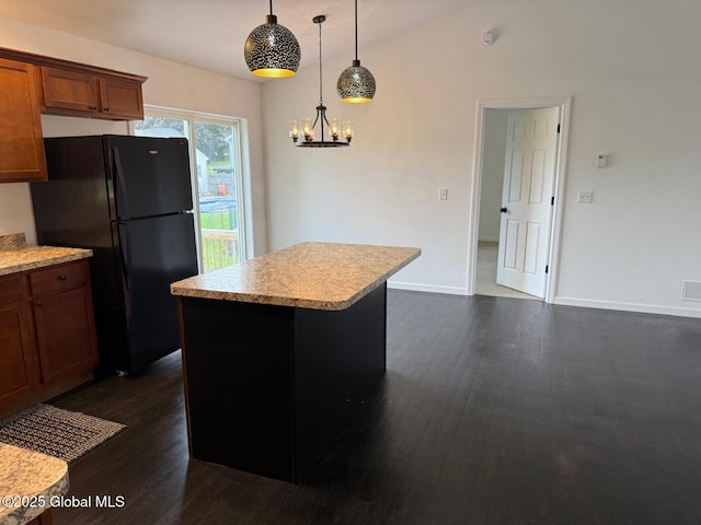 11 E Boylston St, Glens Falls, NY 12801 - kitchen with freestanding refrigerator, dark wood-style flooring, light countertops, a chandelier, and pendant lighting