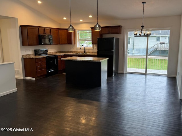 11 E Boylston St, Glens Falls, NY 12801 - kitchen with black appliances, dark wood-style flooring, a chandelier, recessed lighting, and a center island