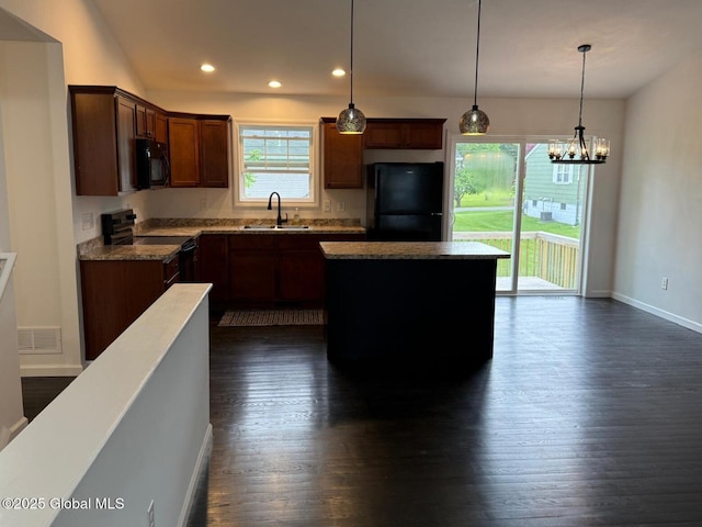 11 E Boylston St, Glens Falls, NY 12801 - kitchen with black appliances, a sink, dark wood finished floors, a kitchen island, and baseboards