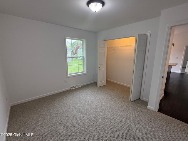 11 E Boylston St, Glens Falls, NY 12801 - unfurnished bedroom with baseboards, carpet flooring, and a closet