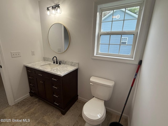 11 E Boylston St, Glens Falls, NY 12801 - bathroom featuring vanity, baseboards, and toilet
