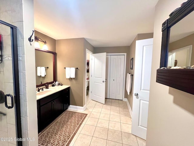 181 Fieldstone Dr, Niskayuna, NY 12304 - bathroom with double vanity, baseboards, a shower stall, and tile patterned flooring