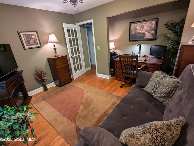 181 Fieldstone Dr, Niskayuna, NY 12304 - living area with wood finished floors, french doors, baseboards, and an office area
