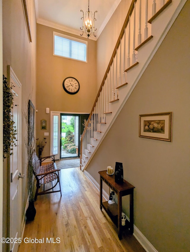 181 Fieldstone Dr, Niskayuna, NY 12304 - entryway with stairway, plenty of natural light, a chandelier, baseboards, and crown molding