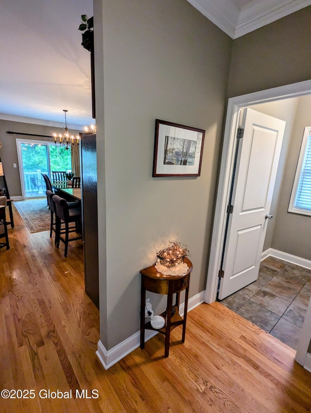 181 Fieldstone Dr, Niskayuna, NY 12304 - hallway with a chandelier, crown molding, baseboards, healthy amount of natural light, and wood finished floors