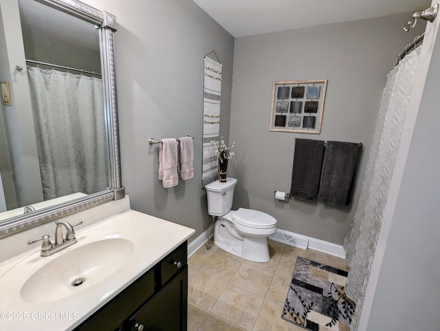 181 Fieldstone Dr, Niskayuna, NY 12304 - bathroom with vanity, toilet, tile patterned flooring, and baseboards