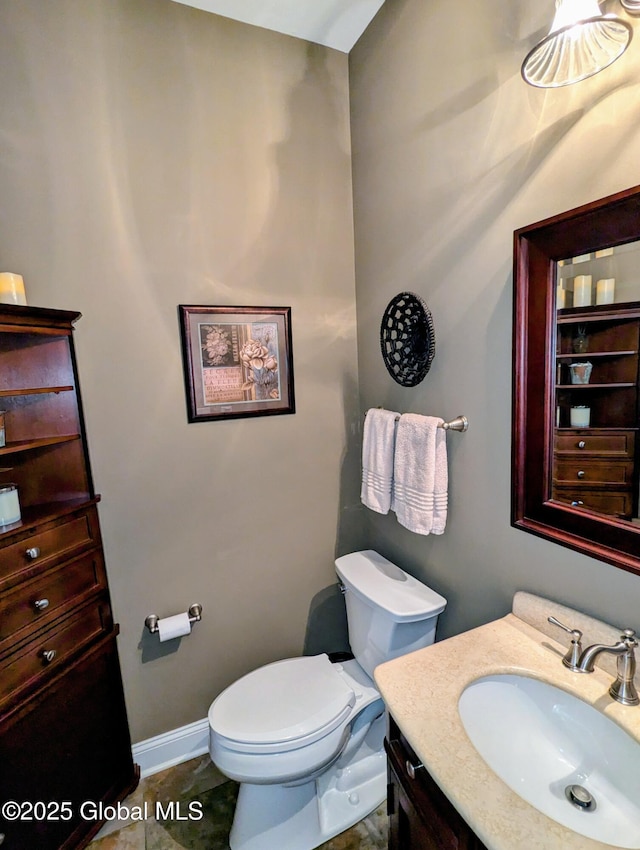 181 Fieldstone Dr, Niskayuna, NY 12304 - bathroom featuring vanity, toilet, and baseboards