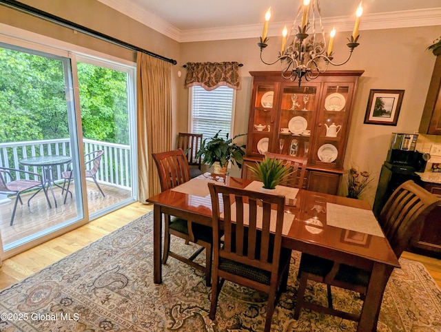 181 Fieldstone Dr, Niskayuna, NY 12304 - dining space with light wood-style floors, a chandelier, and crown molding