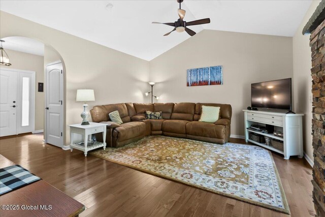 33 White Birch Dr, Lake Luzerne, NY 12846 - living room with ceiling fan, arched walkways, wood finished floors, vaulted ceiling, and baseboards