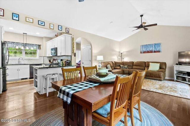33 White Birch Dr, Lake Luzerne, NY 12846 - dining room featuring arched walkways, ceiling fan, wood finished floors, and vaulted ceiling