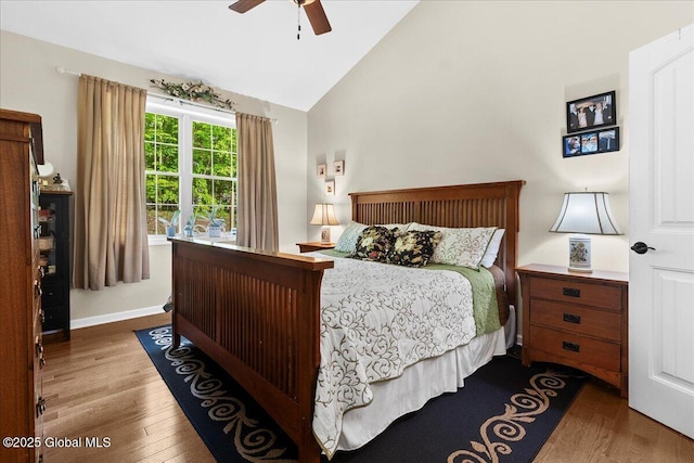 33 White Birch Dr, Lake Luzerne, NY 12846 - bedroom with wood finished floors, high vaulted ceiling, baseboards, and ceiling fan