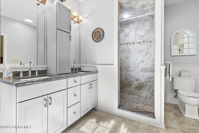 33 White Birch Dr, Lake Luzerne, NY 12846 - bathroom featuring double vanity, a stall shower, and toilet