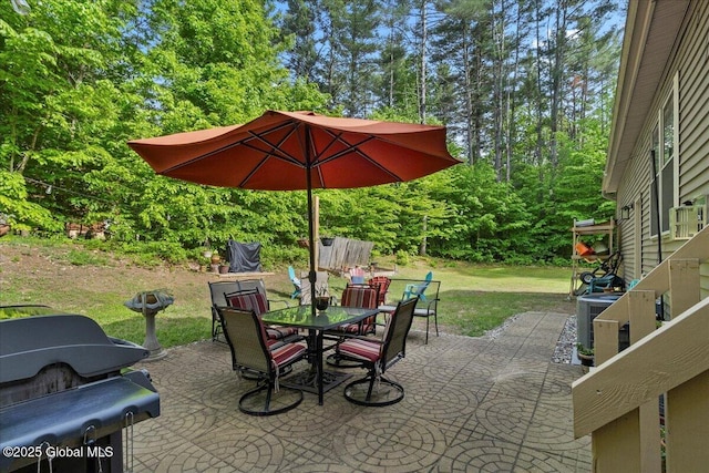 33 White Birch Dr, Lake Luzerne, NY 12846 - view of patio / terrace featuring outdoor dining space and view of scattered trees