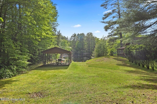 33 White Birch Dr, Lake Luzerne, NY 12846 - view of green lawn featuring a gazebo, a detached carport, and a forest view